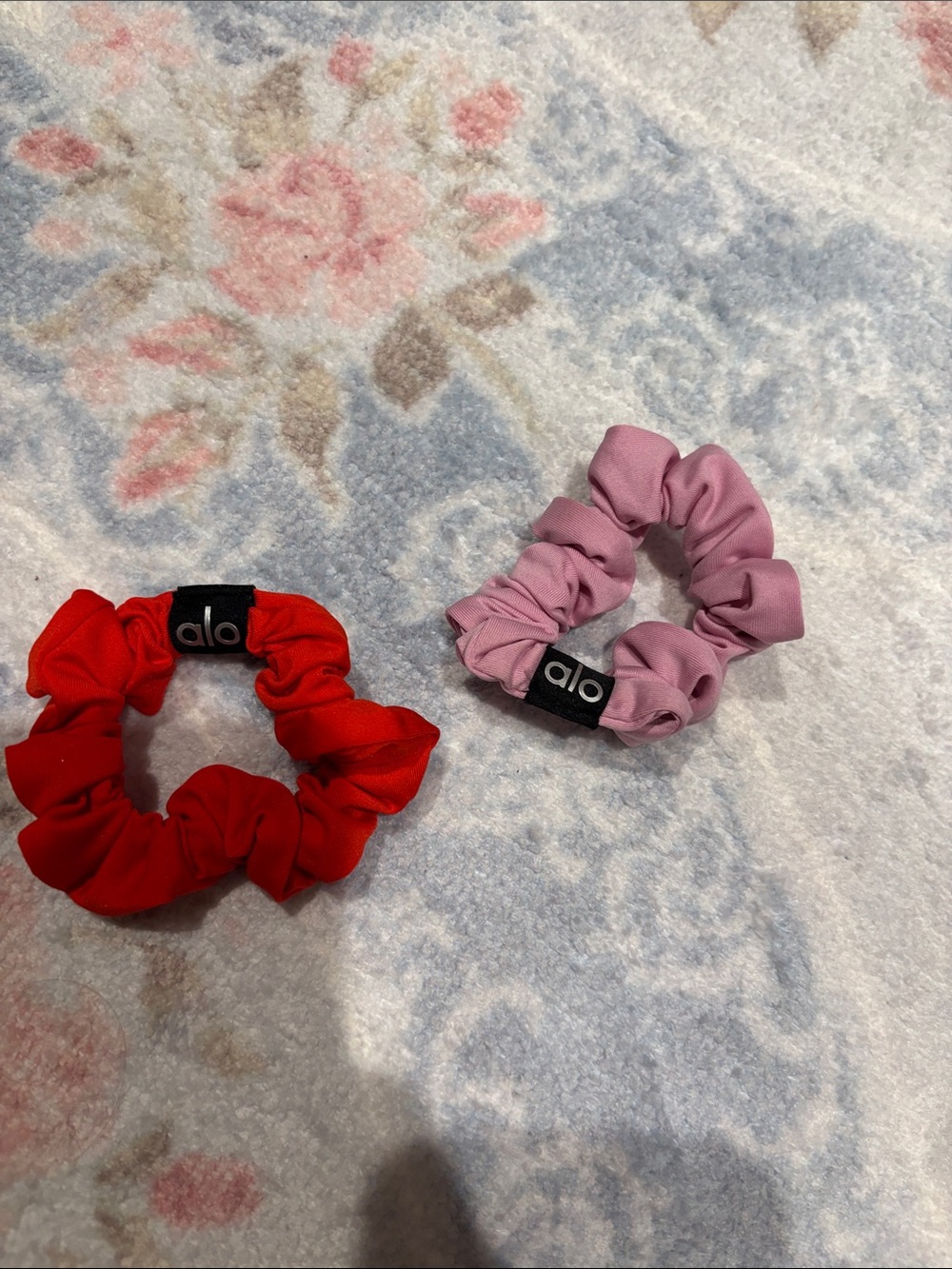 Set of 2 alo scrunchies. Pink and red. Great condition.